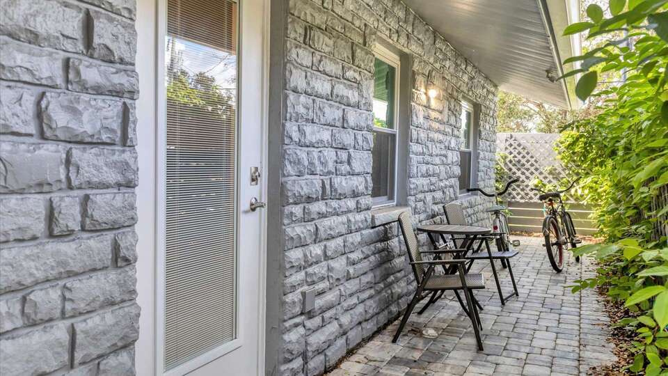 Side entry to bedroom #2. Bicycles for guest use. Bistro set