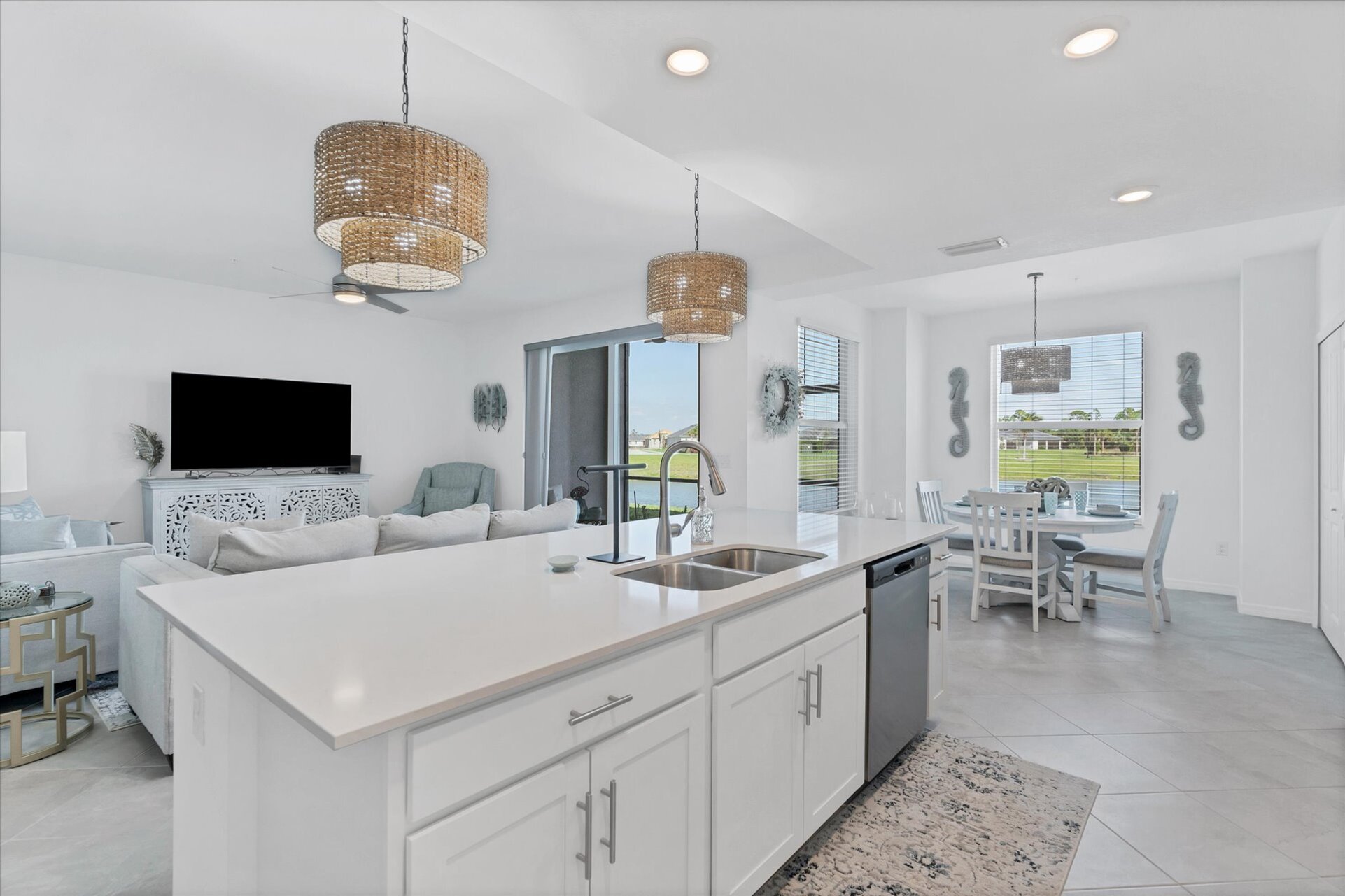 Bright, inviting open living space overlooking pond
