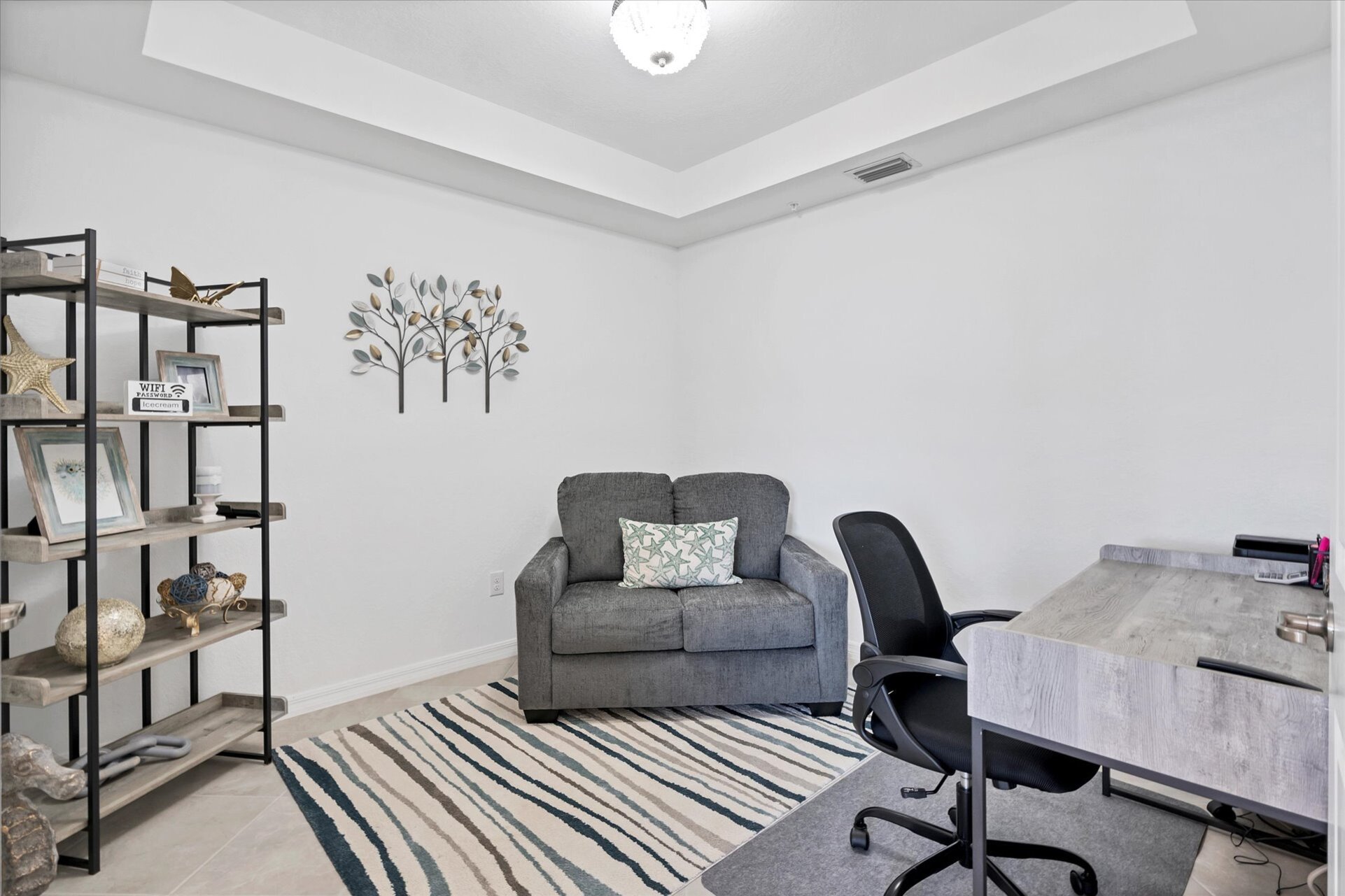 Dedicated office space. Also features a single loveseat sofa bed