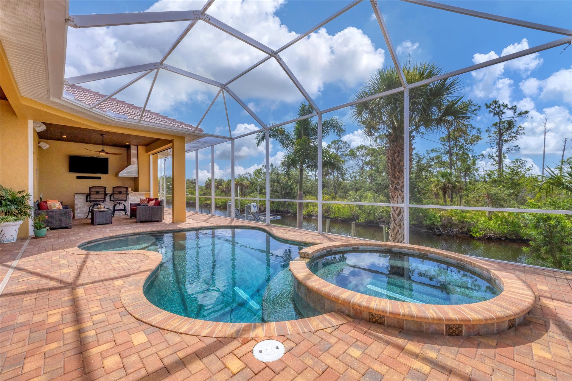 Sparkling saltwater pool & spa overlooking water. Pool size is 17'L x 10'W x 6'D