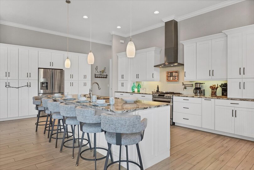 Gorgeous, bright, fully-equipped kitchen with stainless steel appliances, gas range, and plenty of storage & countertop space. Kitchen island seats 6