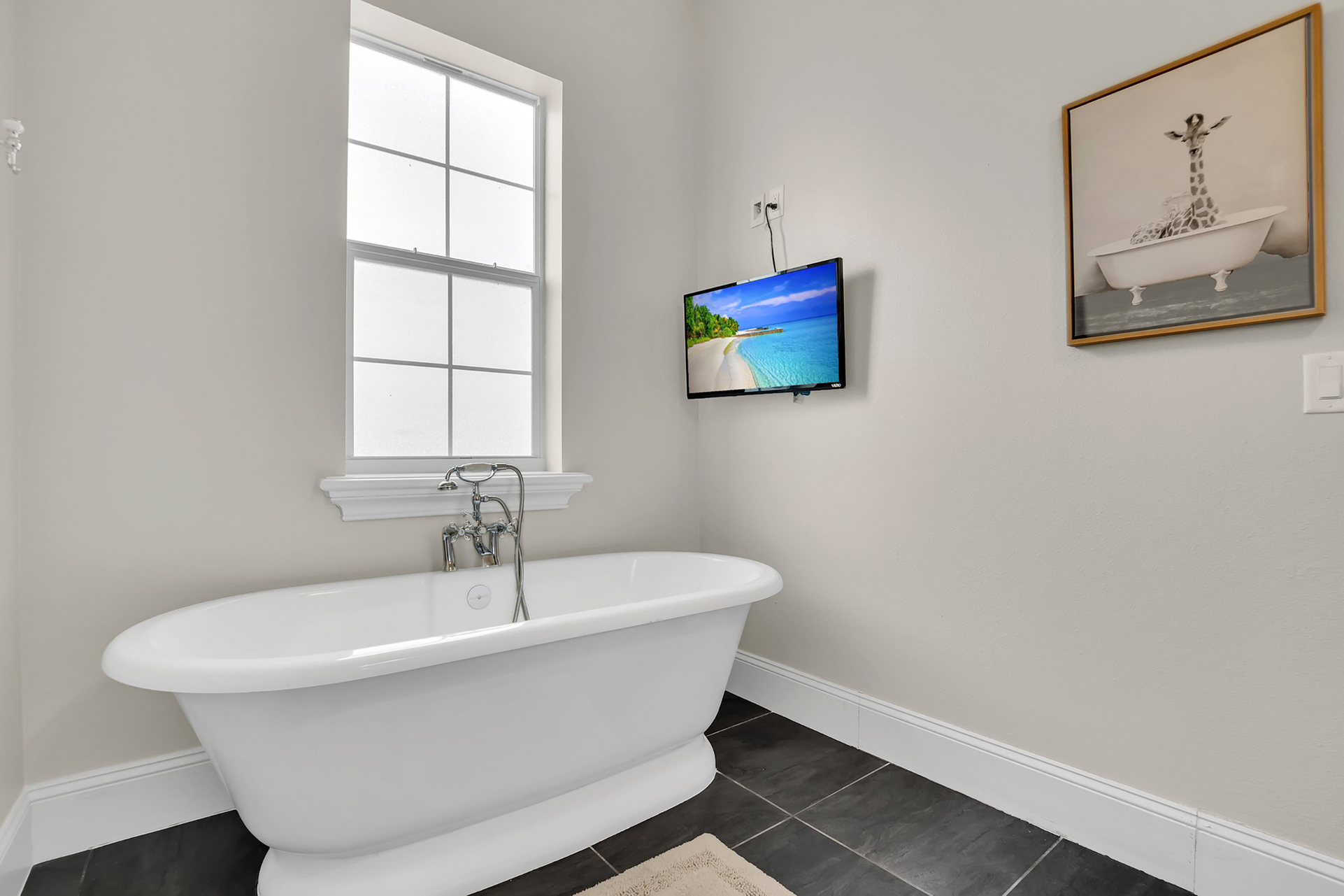 Relax in the soaking tub while catching up on your favorite show