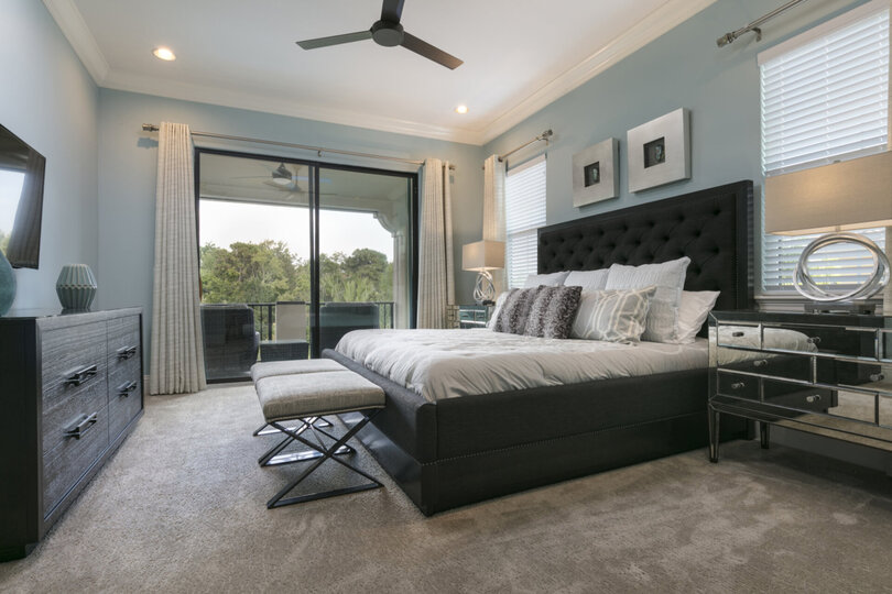 This master suite has a king bed, 50-inch SMART TV, and access to the patio balcony