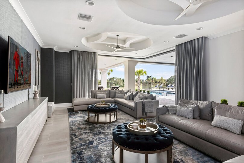 Watch a show on the 74 inch HD 4K SMART TV while relaxing on luxurious leather sectional sofas
DISCLAIMER: the patio doors cannot remain open.