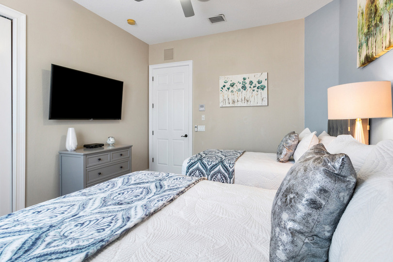 Watch your favorite show before bed in this comfortable bedroom