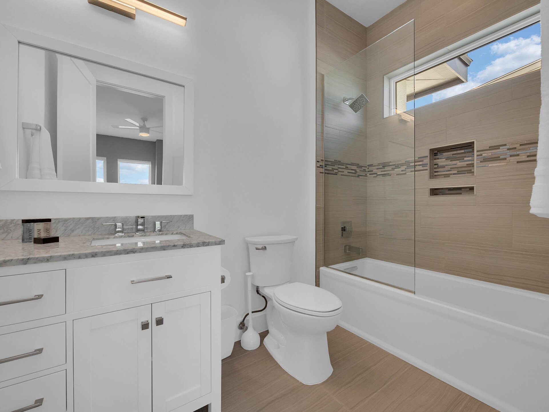 This bathroom has a combination shower and tub