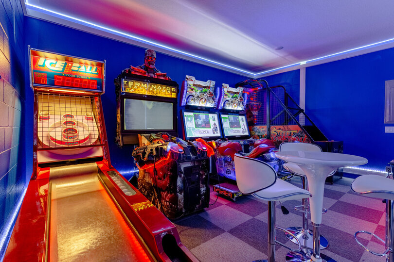 Game room includes commercial Air Hockey table, Basketball, Ice Ball, Terminator, and Dead Heat Rider arcade games