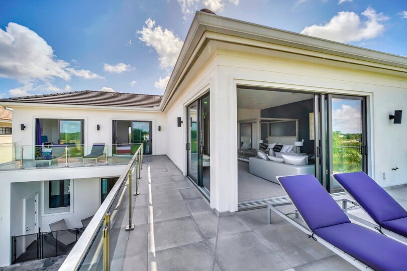 The large wrap-around balcony is a great place to enjoy the Florida sunshine