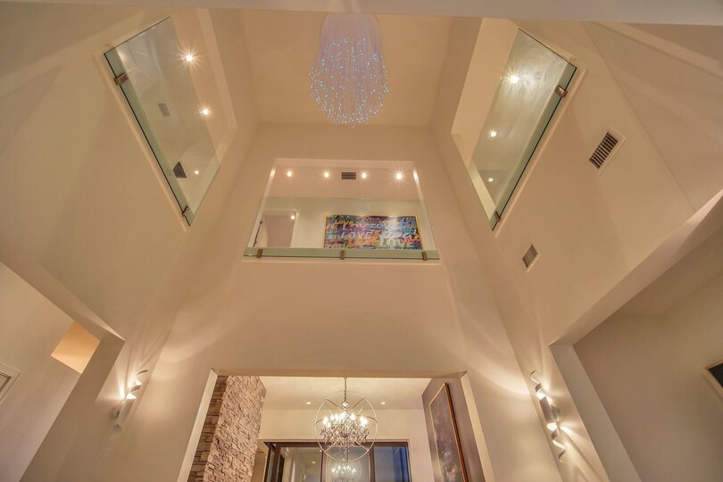 The impressive 2-story foyer greets you as you walk into the home