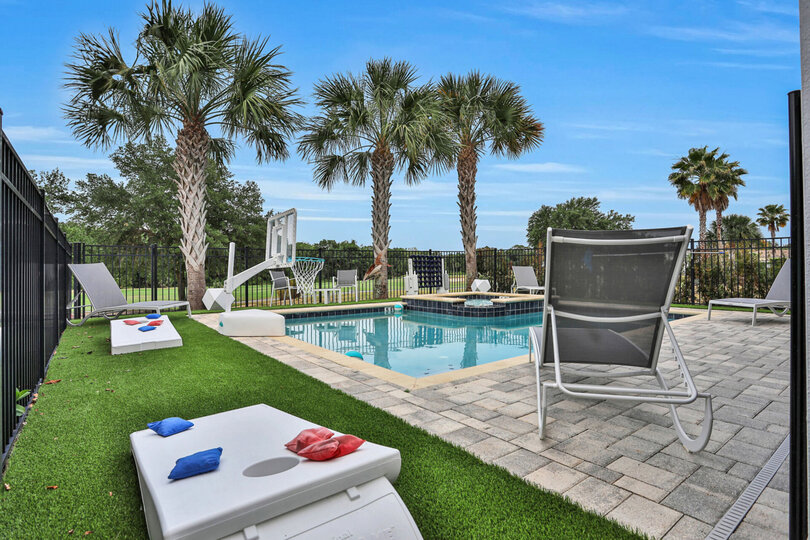 Enjoy a fun game of cornhole by the pool