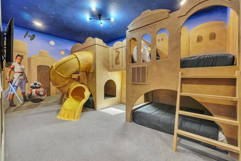 Embark on an epic galactic adventure in our Star Wars-themed bedroom. From lightsaber duels to dreams among the stars, every moment is a journey to remember. May the force be with you in the heart of Reunion Resort!