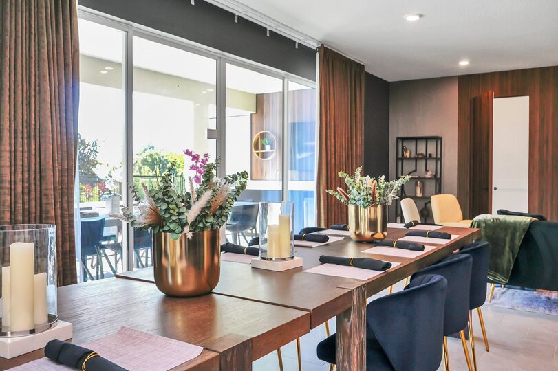 Dine in style at the formal dining table, which comfortably seats 14 guests for any occasion