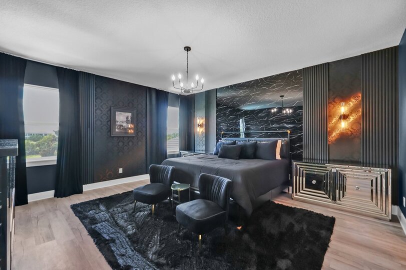 Retreat to the master bedroom, a spacious retreat featuring an industrial-inspired and comfortable furnishings for a unique, relaxed ambiance