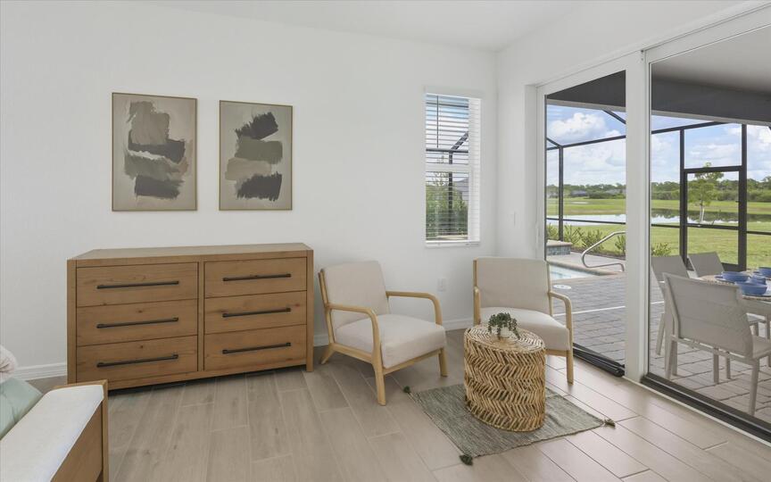 Primary bedroom with king bed, attached bathroom, lanai access, and 65-inch Smart TV