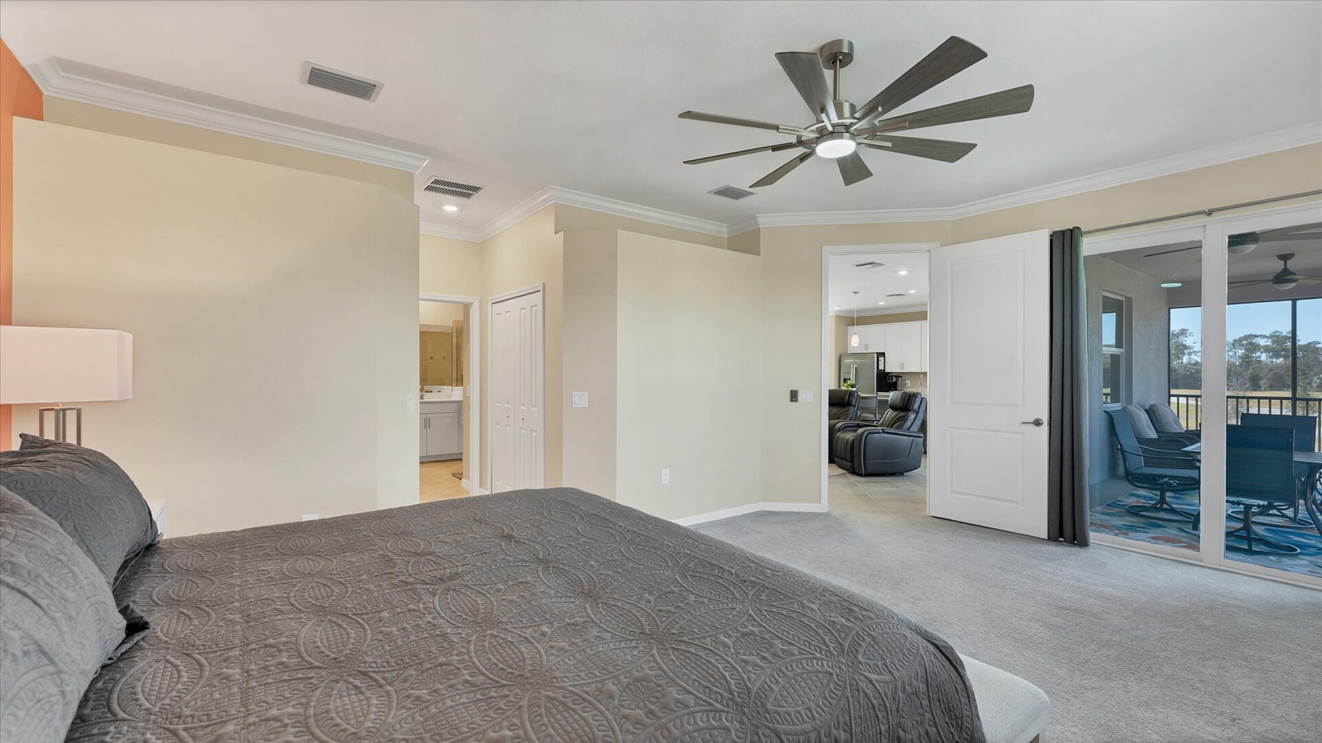 Primary bedroom with king bed and attached bathroom