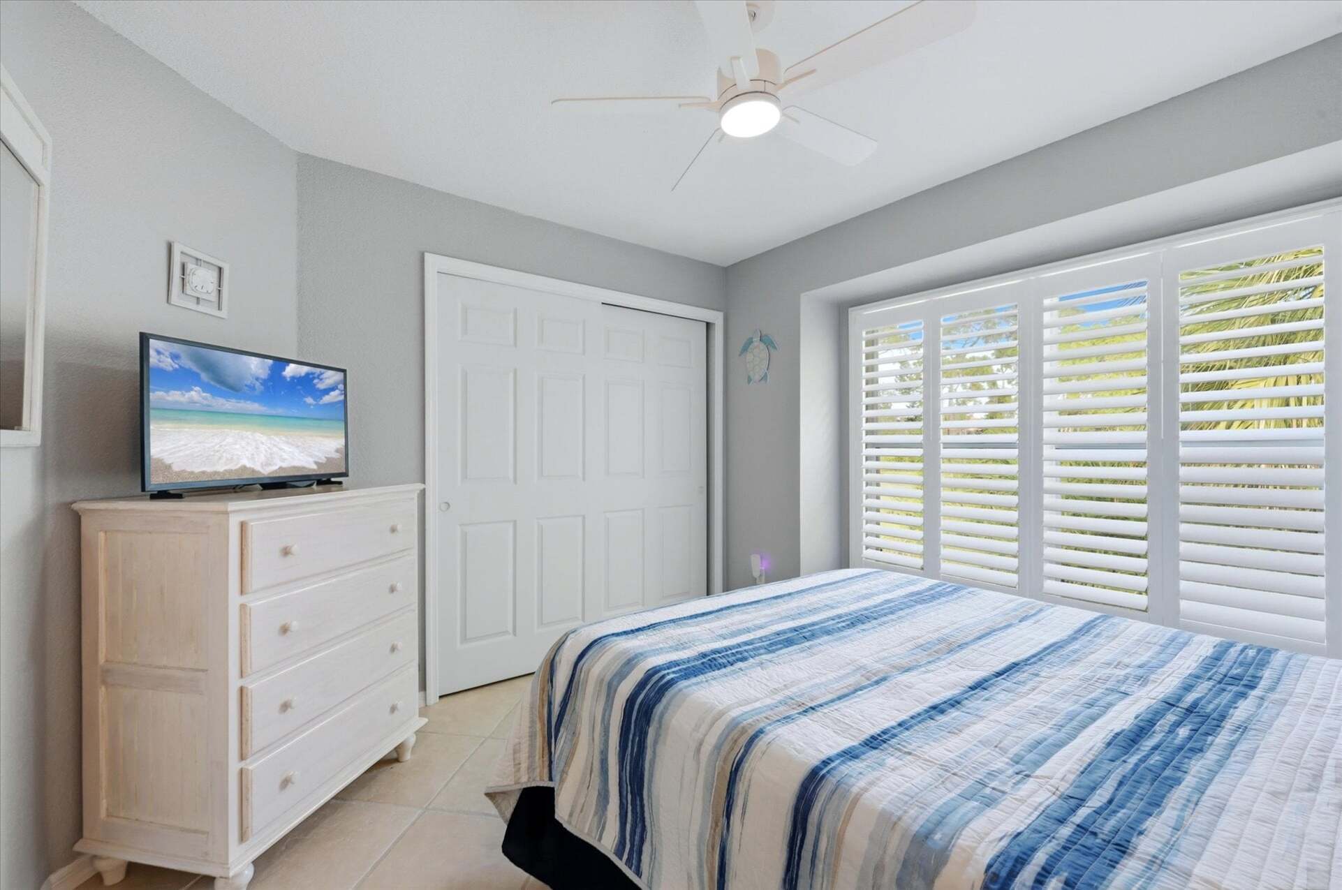 Bedroom 2 with queen bed and 32-inch Smart TV
