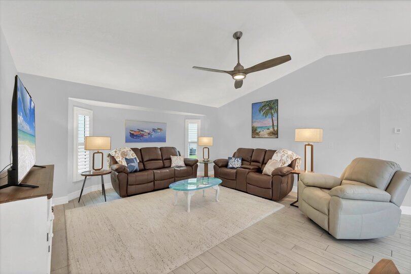 Bright, open living space with 65" TV