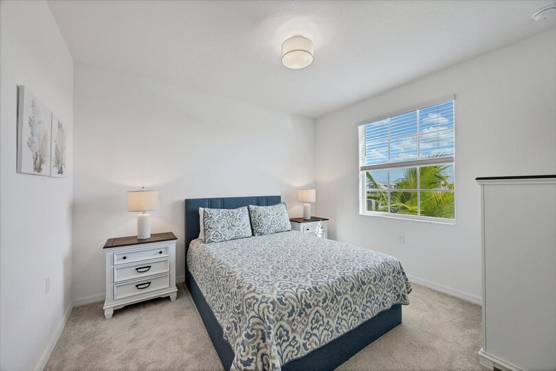Guest bedroom 1 with queen bed and 43-inch Smart TV