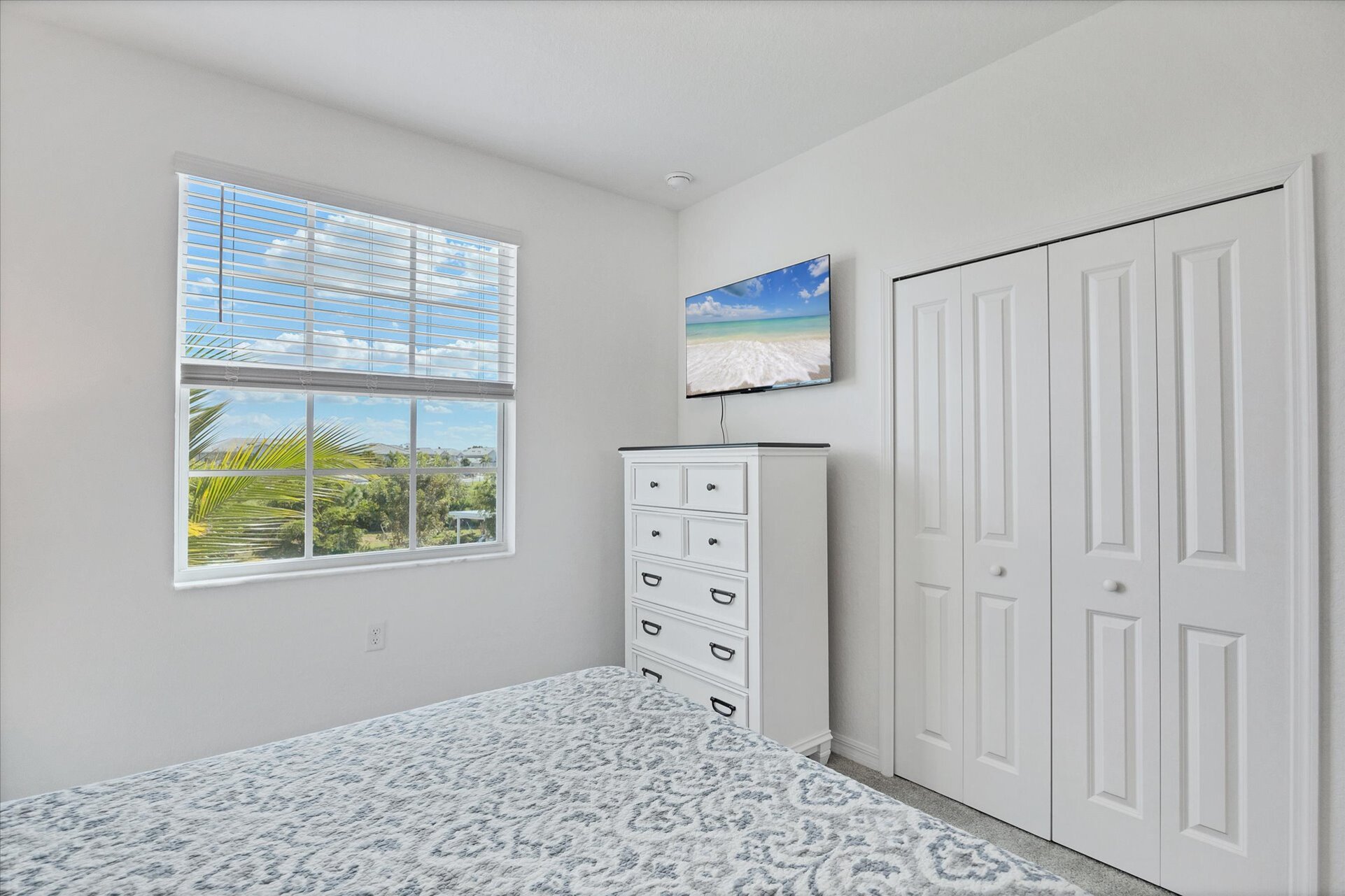 Guest bedroom 1 with queen bed and 43-inch Smart TV