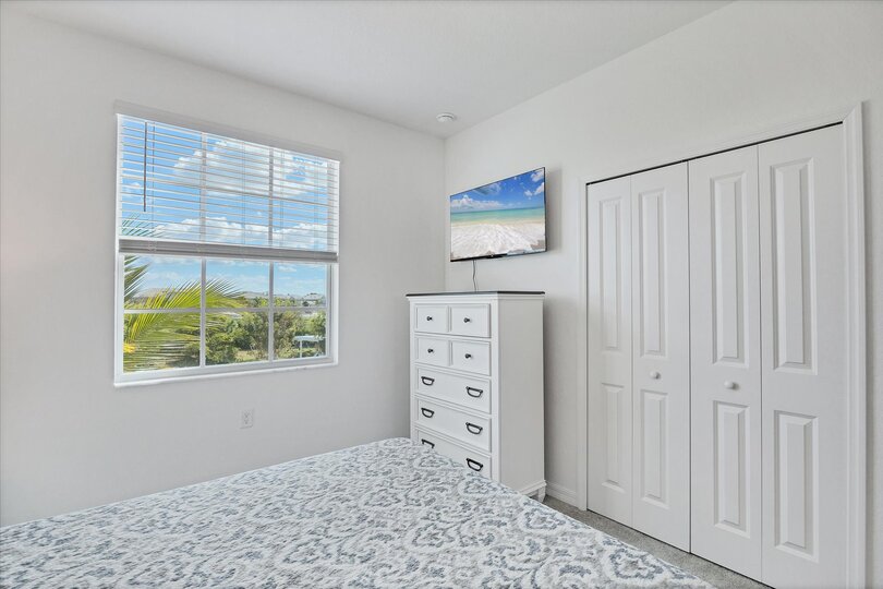 Guest bedroom 1 with queen bed and 43-inch Smart TV