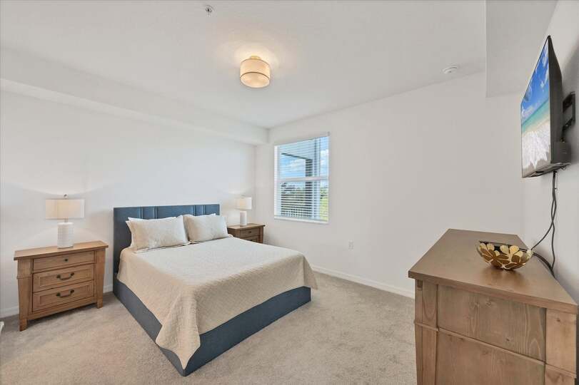 Primary bedroom with queen bed, en suite and 43-inch Smart TV
