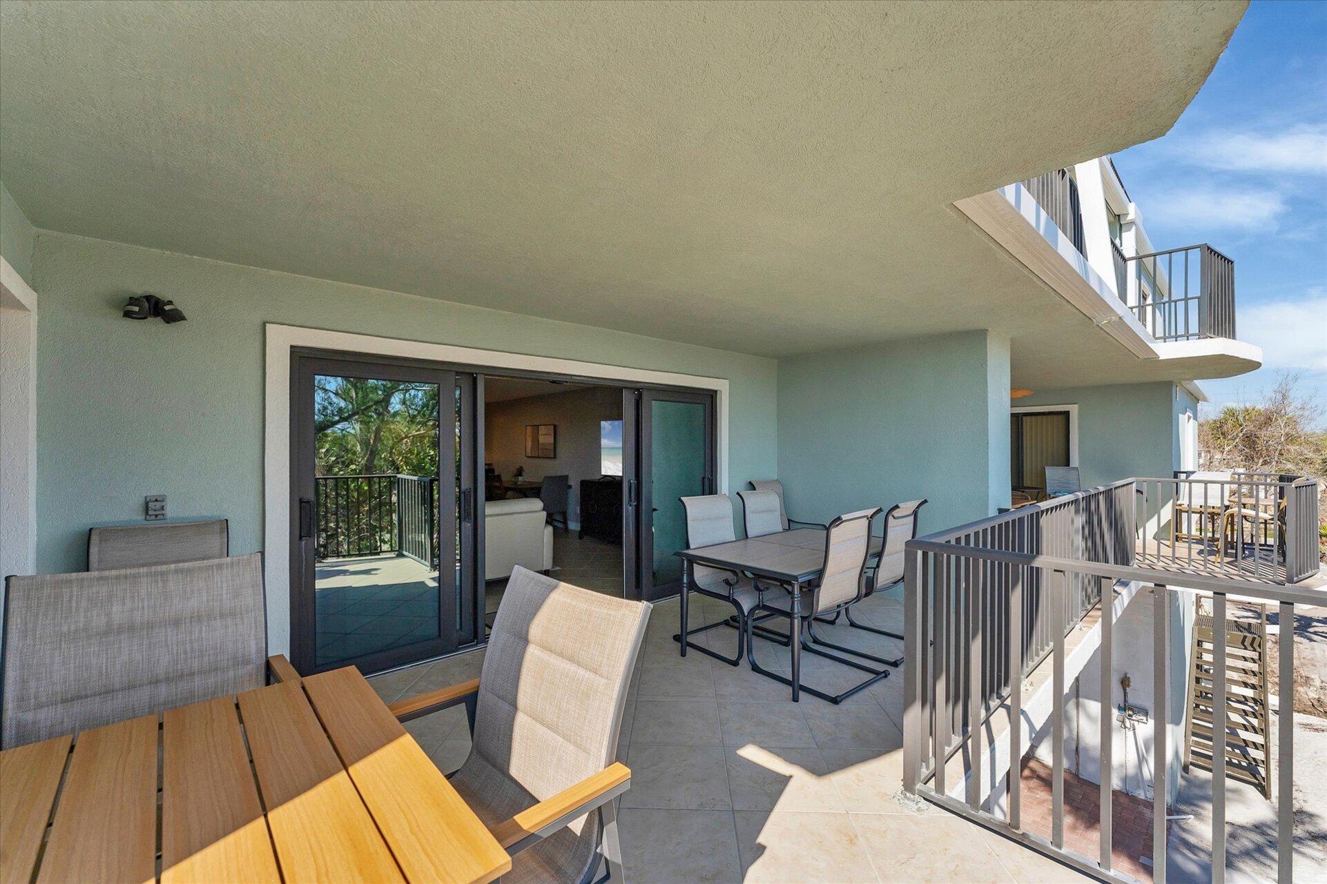 Large balcony overlooking the beach & Gulf of Mexico. Balcony also features two dining tables seating 8 total.