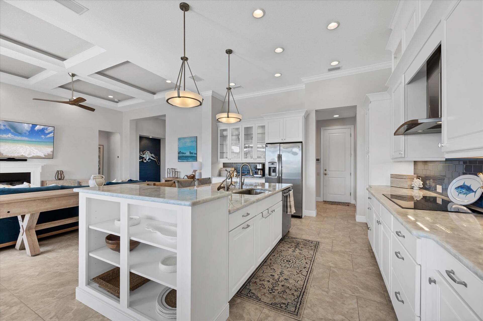 Gorgeous, fully-equipped kitchen over looking the living room and dining areas