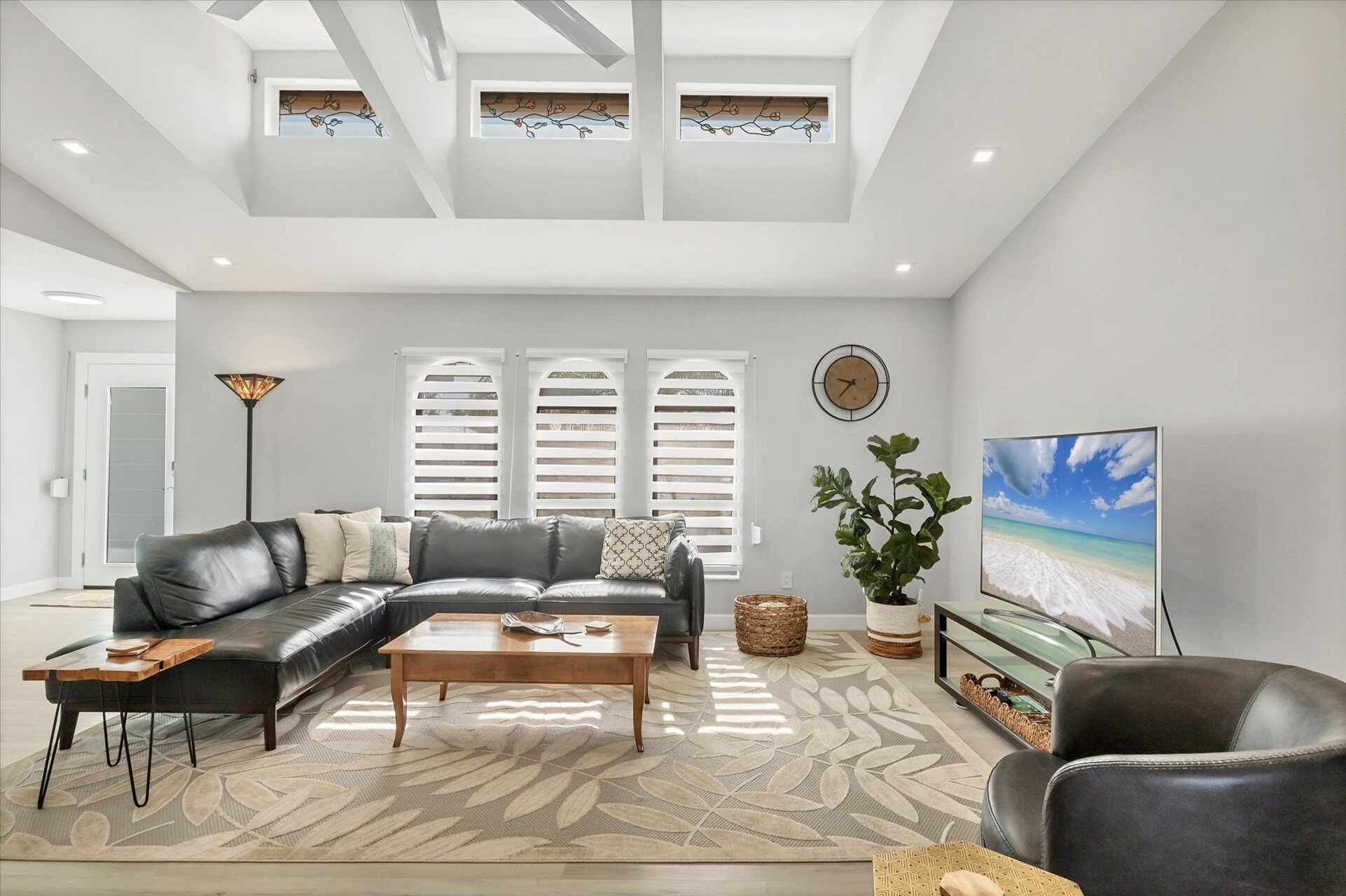 Large, Open, and Bright Living Area with 65" Smart TV
