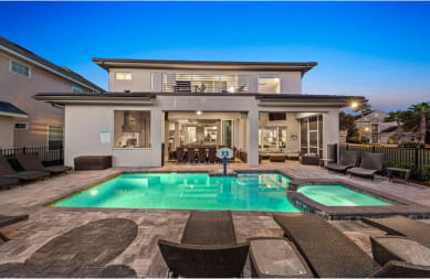 Tropical beach villas  with palm trees and calm waves